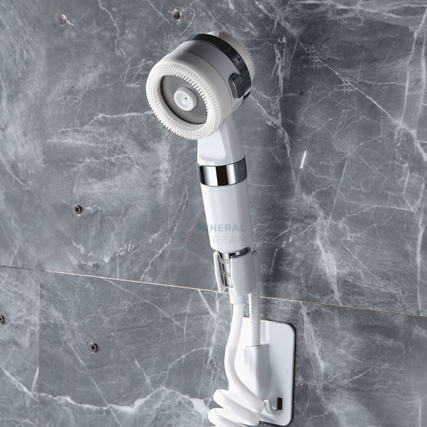 MineralStream™ Cotton filtered shower head, front view in white